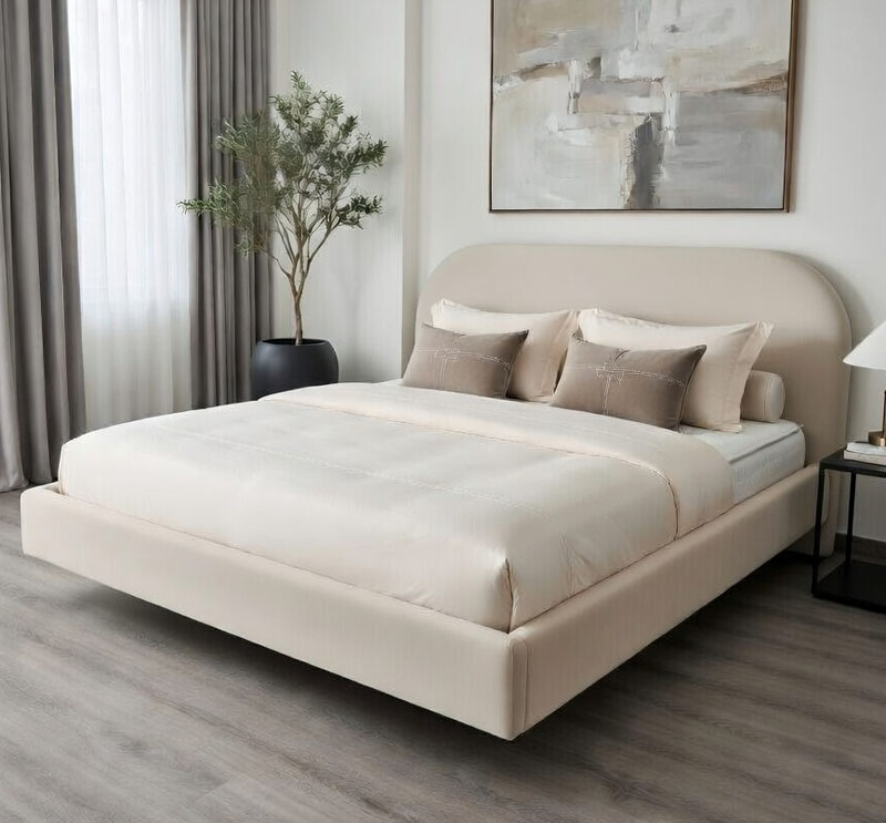 Nowoczesna sypialnia z tapicerowanym łóżkiem L615 Akimo, z zaokrąglonym zagłówkiem i jasną, minimalistyczną aranżacją.